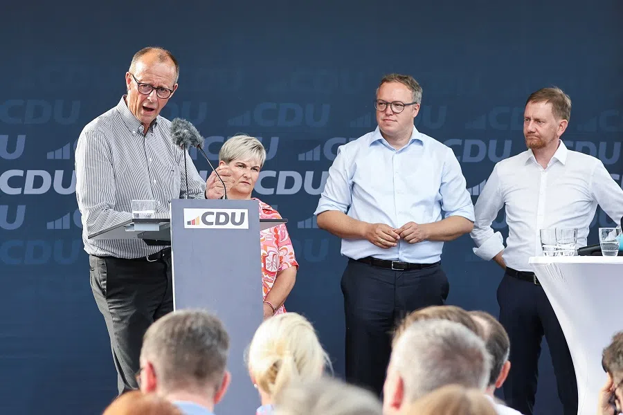 Christian Democratic Union (CDU) leader Friedrich Merz speaks as he and top candidates for Saxony’s Michael Kretschmer and Thuringia’s Mario Voigt campaign for the upcoming state elections with a joint rally in Meerane, Germany, on 18 July 2024. (Karina Hessland/Reuters)