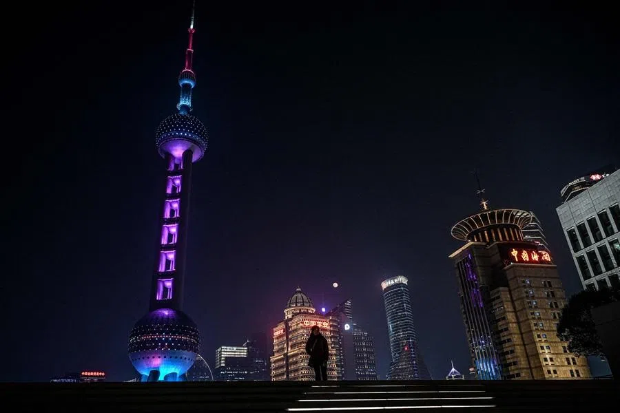 A woman walks past the Oriental Pearl Tower on the rooftop of the Pudong Art Museum, at the financial district of Lujiazui in Shanghai on 2 February 2026. (Jade Gao/AFP)