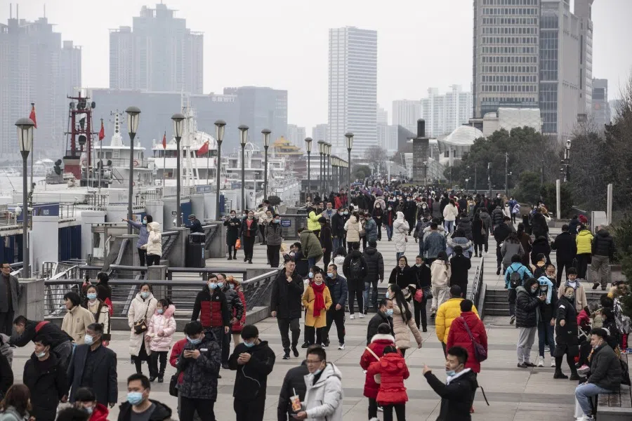 Visitors walk on the Bund in Shanghai, China, on 12 February 2021. (Qilai Shen/Bloomberg)