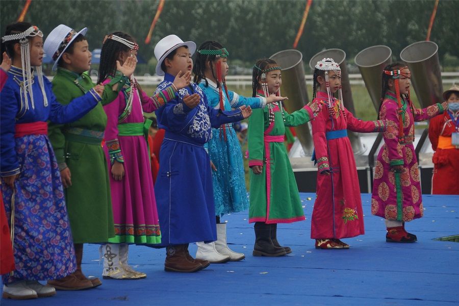 Children in traditional costumes sing and perform at the opening ceremony of the Naadam festival in Hinggan League, Inner Mongolia, 8 August 2020. (CNS)