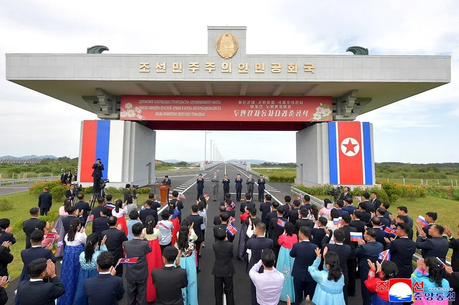 Attendees applaud as North Korea and Russia open their first road bridge, a structure that spans the Tumen river connecting the border cities of Rason and Khasan,  in this picture released by North Korea's official Korean Central News Agency on 7 September 2026.