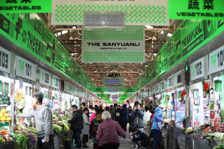 Sanyuanli Market decorated in neon green in collaboration with BMW. (Twitter/@technodechina)