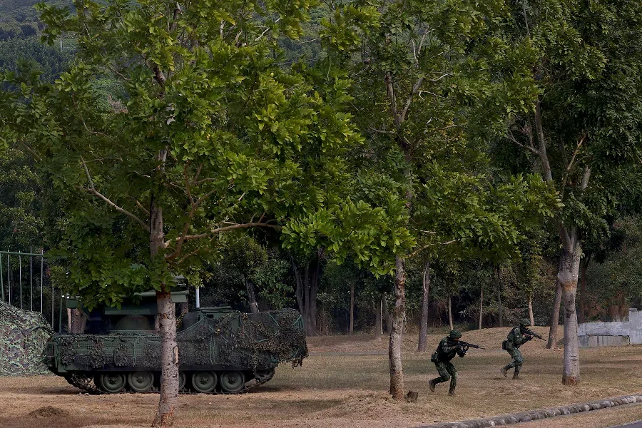 Taiwan's armed forces hold two days of routine drills to show combat readiness at a military base in Kaohsiung, Taiwan, 11 January 2023. (Ann Wang/Reuters)