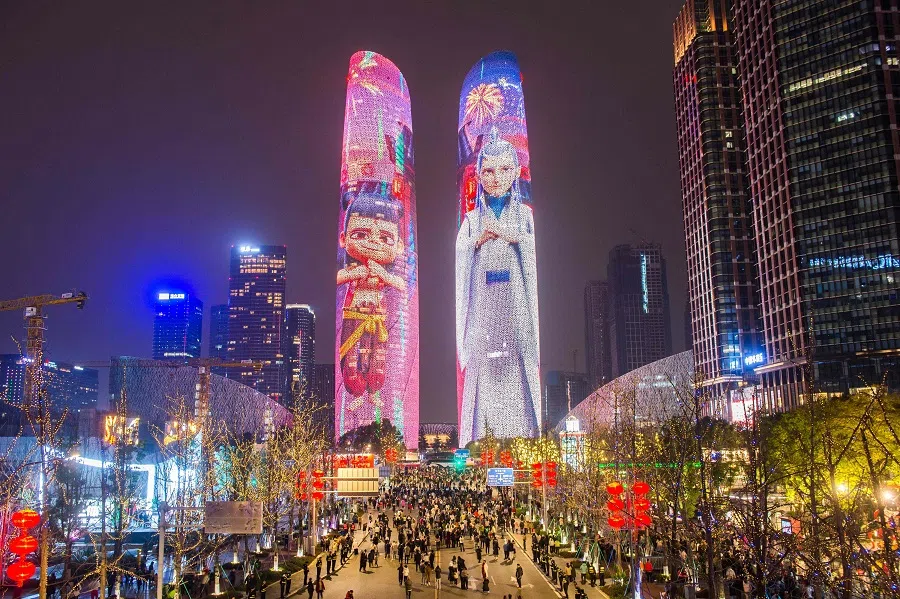 Buildings are lit up with characters from the movie Ne Zha 2 in Chengdu, Sichuan province, China on 12 February 2025. (AFP)
