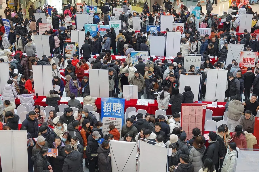 People gather at a spring job fair in Yantai, in China’s eastern Shandong province on 6 February 2025. (AFP)