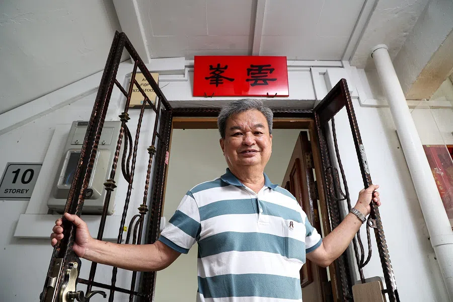 Toh Siam Ker hangs a tanghao on his HDB door, hoping to preserve this tradition passed down by his ancestors.