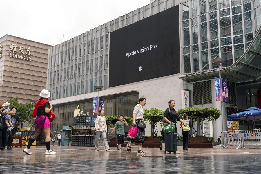 People walk on a street in Shanghai, China, on 28 June 2024. (Raul Ariano/Bloomberg)