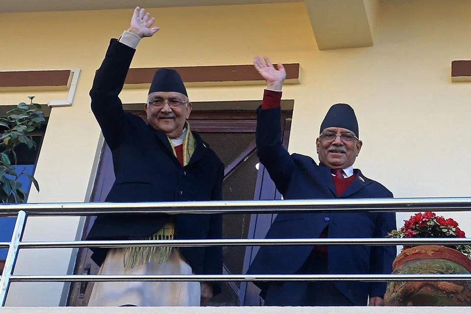 Leader of Maoist Centre Party Pushpa Kamal Dahal (right), better known by his nom de guerre Prachanda, waves next to Communist Party Nepal-Union Marxist Leninist (CPN-UML) chairman KP Oli, before leaving for the president's office to claim majority for his appointment as the new prime minister, in Bhaktapur on the outskirts of Kathmandu, Nepal, on 25 December 2022. (Dipesh Shrestha/AFP)