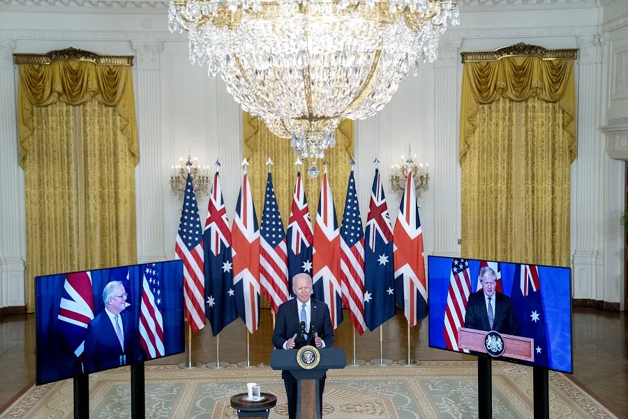 US President Joe Biden speaks in the East Room of the White House in Washington, DC, US, on 15 September 2021. Australian Prime Minister Scott Morrison appears on screen on the left, while UK Prime Minister Boris Johnson appears on screen on the right. (Stefani Reynolds/Bloomberg)