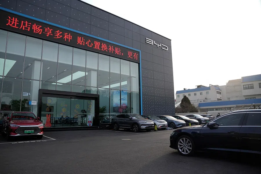 A view of vehicles parked outside at a BYD car dealership in Shanghai, China, 3 February 2023. (Aly Song/Reuters)