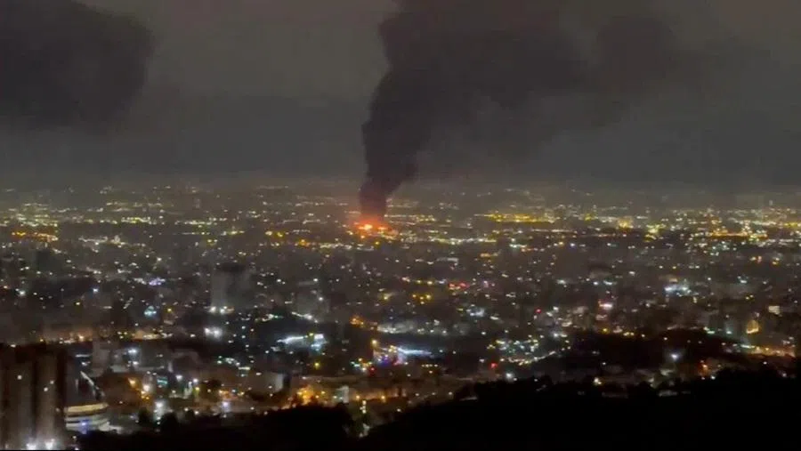 Smoke rises after air strikes, amid the US-Israeli conflict with Iran, in Tehran, in this screen grab obtained from a social media video released on 16 March 2026. (Social Media via Reuters)