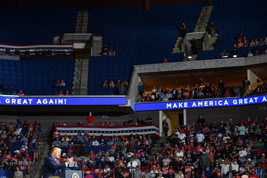 In this file photo, the upper section of the arena is seen partially empty as US President Donald Trump speaks during a campaign rally at the BOK Center on 20 June 2020 in Tulsa, Oklahoma. (Nicholas Kamm/AFP)