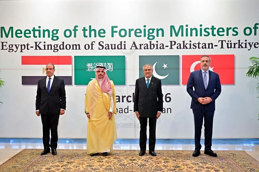 This handout photograph taken on 29 March 2026 and released by Pakistan's Ministry of Foreign Affairs shows Pakistan's Foreign Minister Ishaq Dar (second from right) posing for a photograph with his counterparts — Turkey's Hakan Fidan (right), Saudi Arabia's Faisal bin Farhan (second from left) and Egypt's Badr Abdelatty — before their meeting at the foreign ministry office in Islamabad. (Pakistan’s Ministry of Foreign Affairs/Handout via AFP)