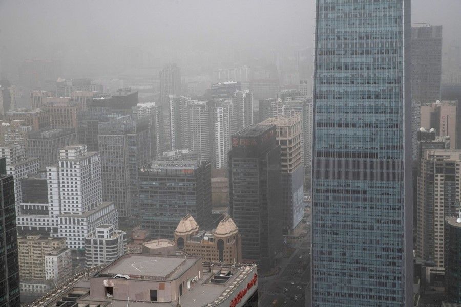 Buildings shrouded in smog during a sandstorm in Beijing, China, on 22 March 2023. (Bloomberg)