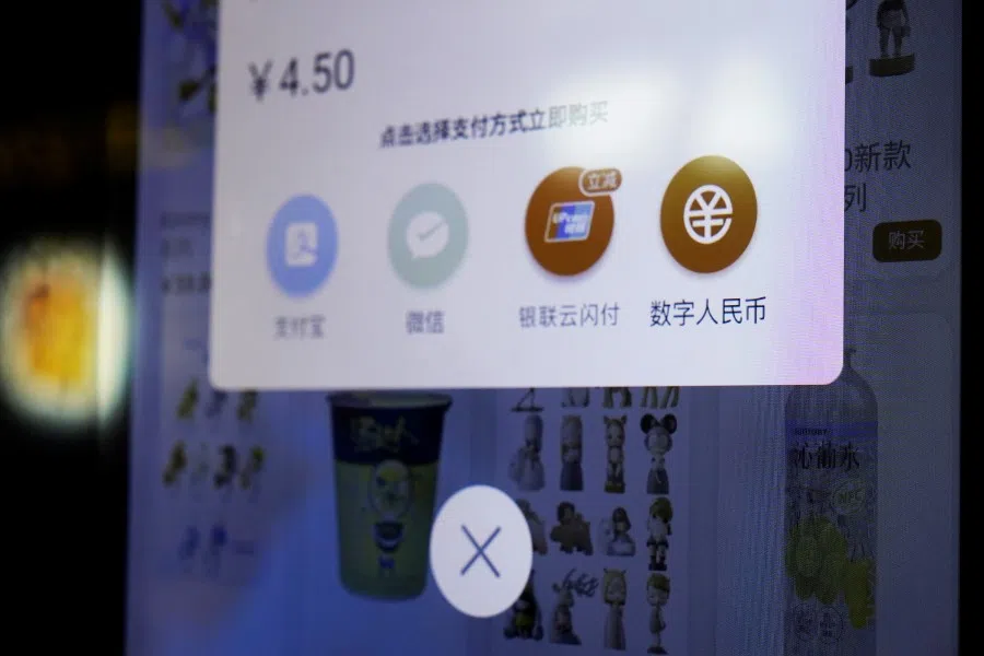 A sign indicating digital yuan, also referred to as e-CNY, is pictured on a vending machine at a subway station in Shanghai, China, 21 April 2021. (Aly Song/Reuters)