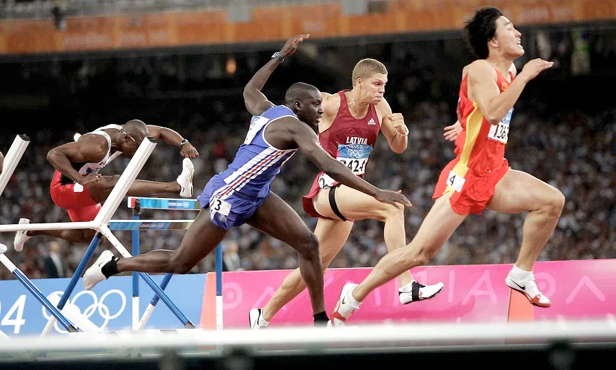 China’s Liu Xiang wins the 110m hurdles gold medal at the 2004 Olympics in Athens. (SPH Media)