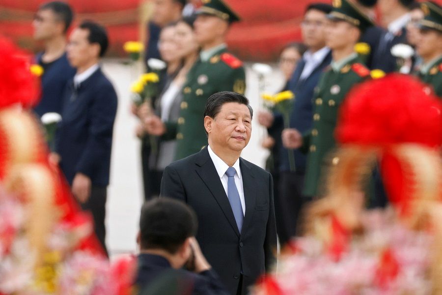 Chinese President Xi Jinping arrives for a ceremony at the Monument to the People's Heroes at Tiananmen Square to mark Martyrs' Day, in Beijing, China, 30 September 2021. (Carlos Garcia Rawlins/Reuters)