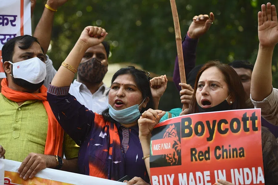 Demonstrators shout slogans as they take part in a protest march against China near the Chinese Embassy in New Delhi on 20 October 2020. (Sajjad Hussain/AFP)