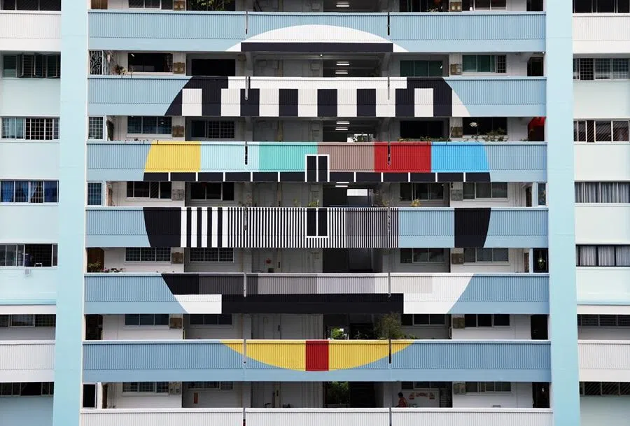 The facade of a public housing estate shows a television test pattern in Singapore, on 30 March 2026. (Edgar Su/Reuters)