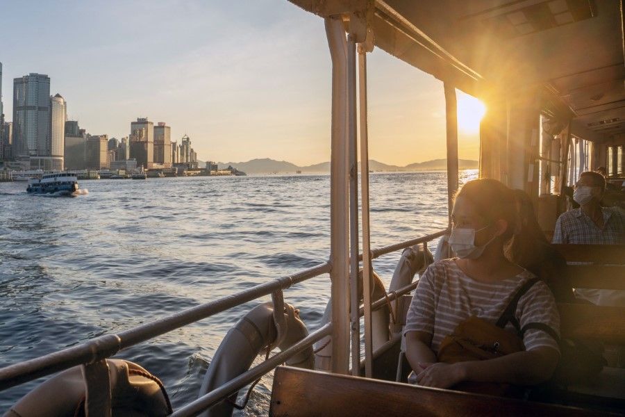 Passengers ride a Star Ferry vessel across Victoria Harbor in Hong Kong, China, on 28 June 2022. (Chan Long Hei/Bloomberg)