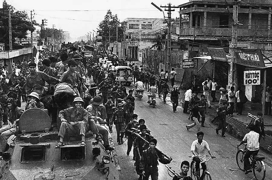 This photo from 30 April 1975 shows jubilant communist troops on top of trucks and APCs making their way to the centre of Saigon as the city fell under their control. Vietnam prepares to mark 50 years since the fall of Saigon, when North Vietnamese forces captured the South’s capital and sealed the country’s reunification. (Vietnam News Agency/AFP)