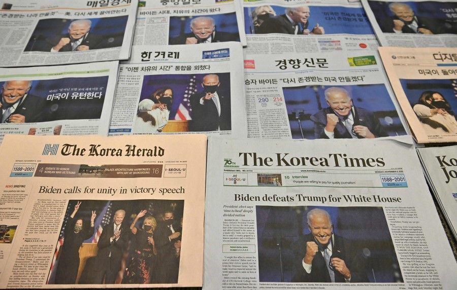 This photo illustration taken in Seoul on 9 November 2020 shows the front pages of South Korea's newspapers carrying stories and pictures of US President-elect Joe Biden. (Jung Yeon-je/AFP)
