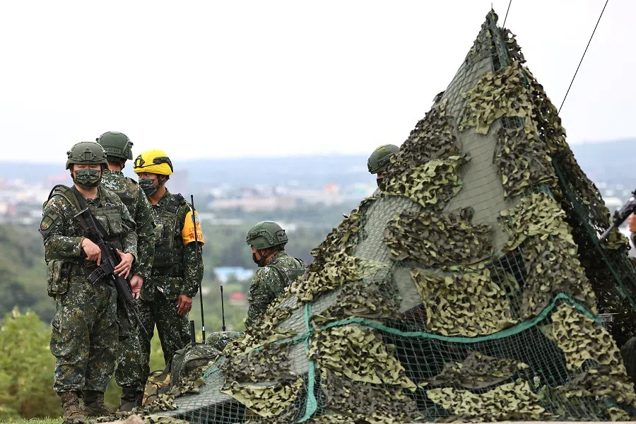 Soldiers stand guard before a live-fire military exercise in Pingtung, Taiwan, 7 September 2022. (Ann Wang/Reuters)