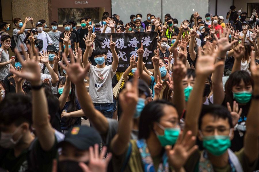 Protesters chant slogans during a rally against a new national security law in Hong Kong on 1 July 2020, on the 23rd anniversary of the city's handover from Britain to China. (Dale De La Rey/AFP)