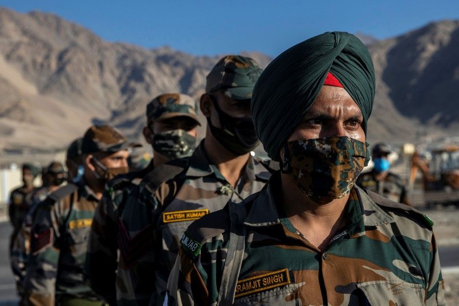 Indian soldiers stand in a formation after disembarking from a military transport plane at a forward airbase in Leh, in the Ladakh region, 15 September 2020. (Danish Siddiqui/REUTERS)