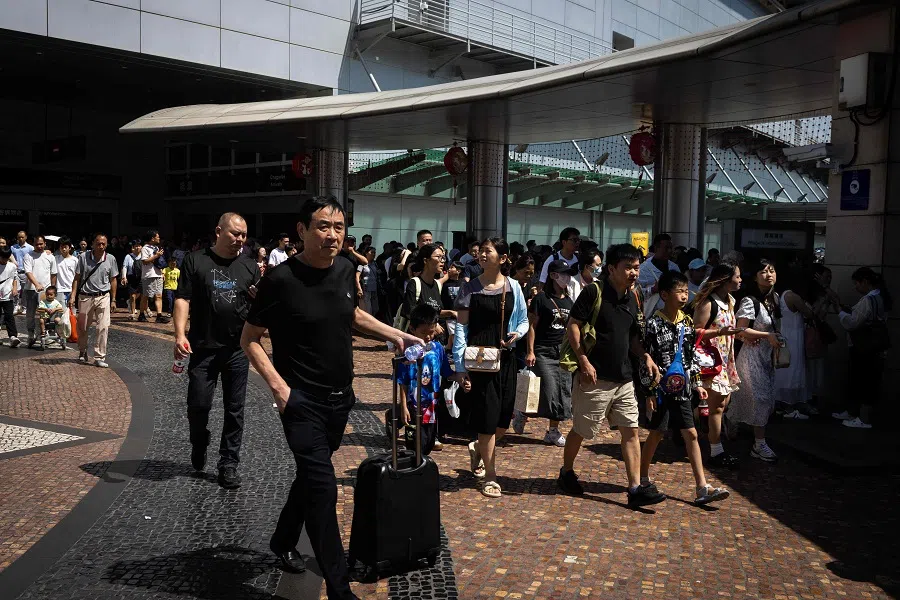 Visitors enter the city from mainland China through the border gate during the Golden Week in Macau on 3 October 2024. (Eduardo Leal/AFP)