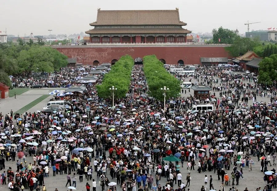 Tourists crowd to visit the Forbidden City during the May Day holiday in Beijing, on 1 May 2009.