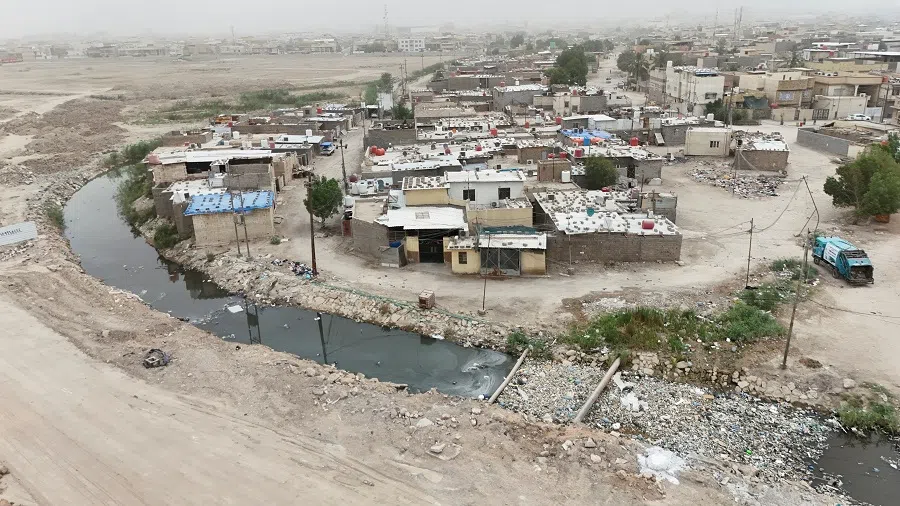 A drone view shows a polluted section of the Al-Ashar River running through a residential neighborhood in Basra, Iraq, on 29 April 2025. (Mohammed Aty/Reuters)