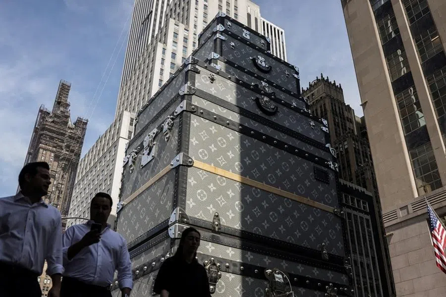 Pedestrians walk past the Louis Vuitton flagship store in Midtown Manhattan in New York City, on 15 April 2026.