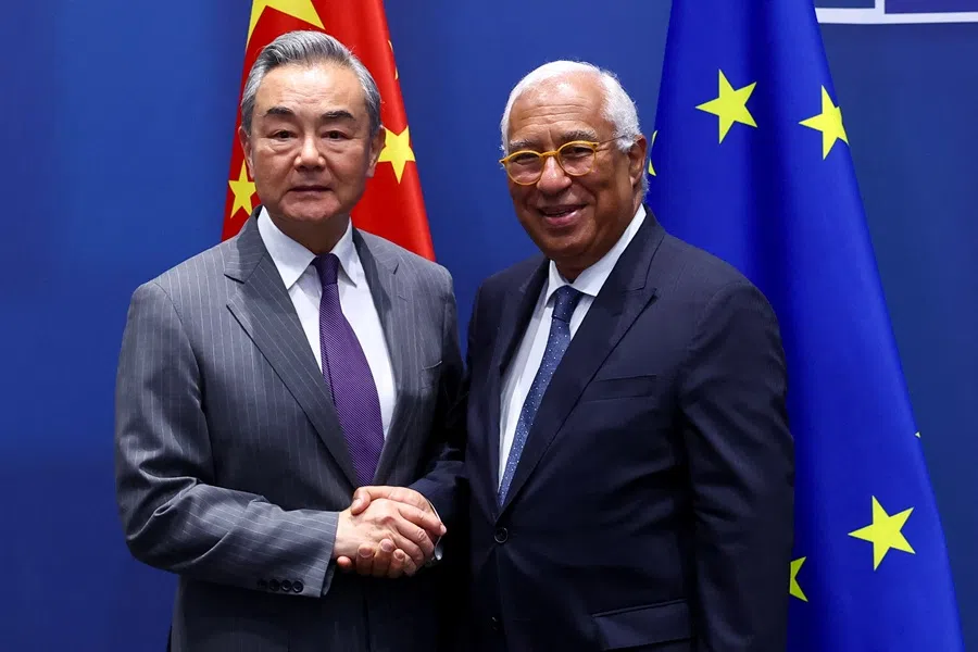 Chinese Foreign Minister Wang Yi shakes hands with European Council President Antonio Costa in Brussels, Belgium, on 2 July 2025. (Yves Herman/Reuters)