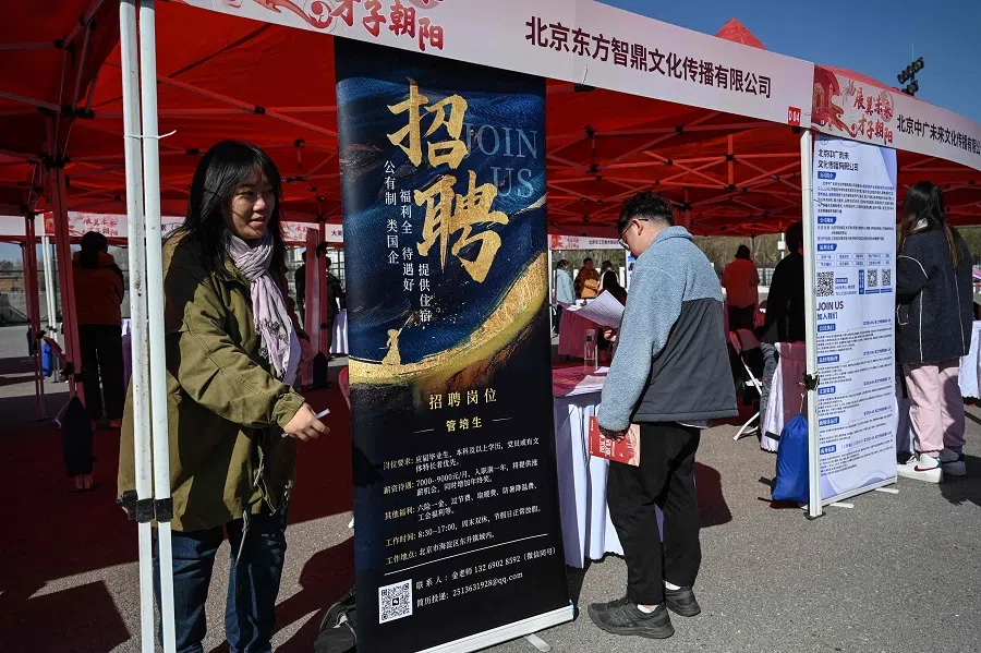 Job seekers attend a job fair in Beijing on 20 March 2024. (Jade Gao/AFP)