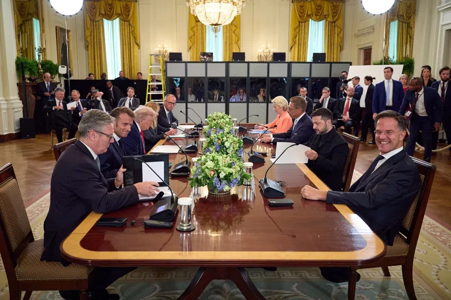 Ukrainian President Volodymyr Zelenskyy during his meeting with NATO secretary-general Mark Rutte, British Prime Minister Keir Starmer, French President Emmanuel Macron, US President Donald Trump, Finnish President Alexander Stubb, Italian Prime Minister Giorgia Meloni, German Chancellor Friedrich Merz, and European Commission President Ursula von der Leyen in the East Room of the White House in Washington, DC, on 18 August 2025. (Handout/Ukrainian Presidential Press Service/AFP)