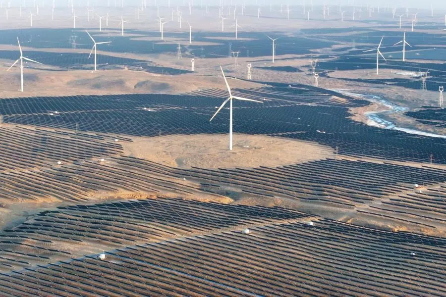 This picture taken on 11 March 2026 shows solar panels and wind turbines in Lingwu in China’s northern Ningxia region. (AFP)