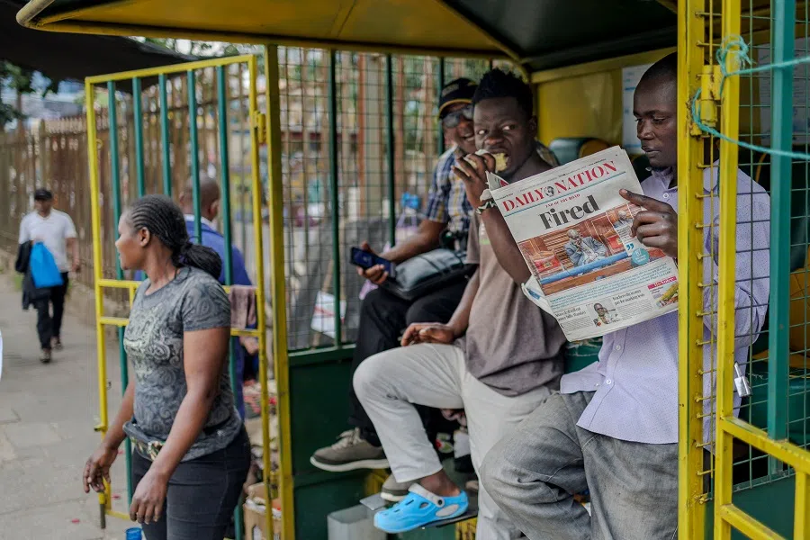 A man reads a newspaper in Nairobi, Kenya, on 18 October 2024. (Tony Karumba/AFP)