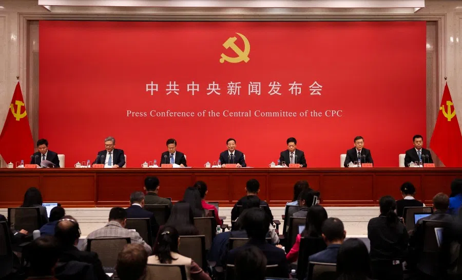 Chinese officials attend a press conference on the fourth plenum of the Chinese Communist Party Central Committee, in Beijing, China, 24 October 2025. (Maxim Shemetov/Reuters)