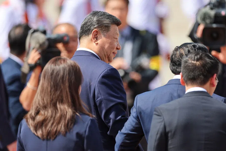 Chinese President Xi Jinping (centre) leaves to board his plane for departure following his visit to Vietnam at Noi Bai International Airport in Hanoi on 15 April 2025.