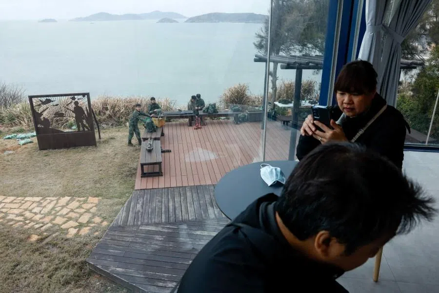 Soldiers rest outside the War and Peace Memorial Park Exhibition Center on Beigan Island, Matsu archipelago, Taiwan, on 16 March 2026. (Ann Wang/Reuters)