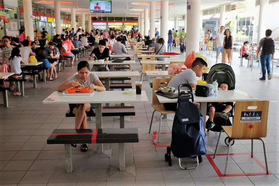 People eating at a hawker centre in Singapore. (SPH Media)