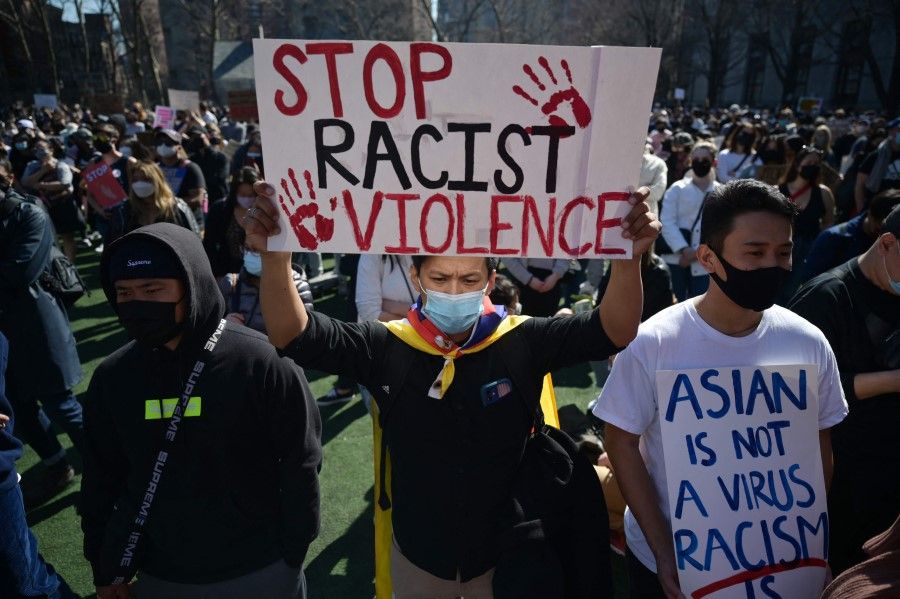 Members and supporters of the Asian-American community attend a "rally against hate" at Columbus Park in New York City on 21 March 2021. (Ed Jones/AFP)