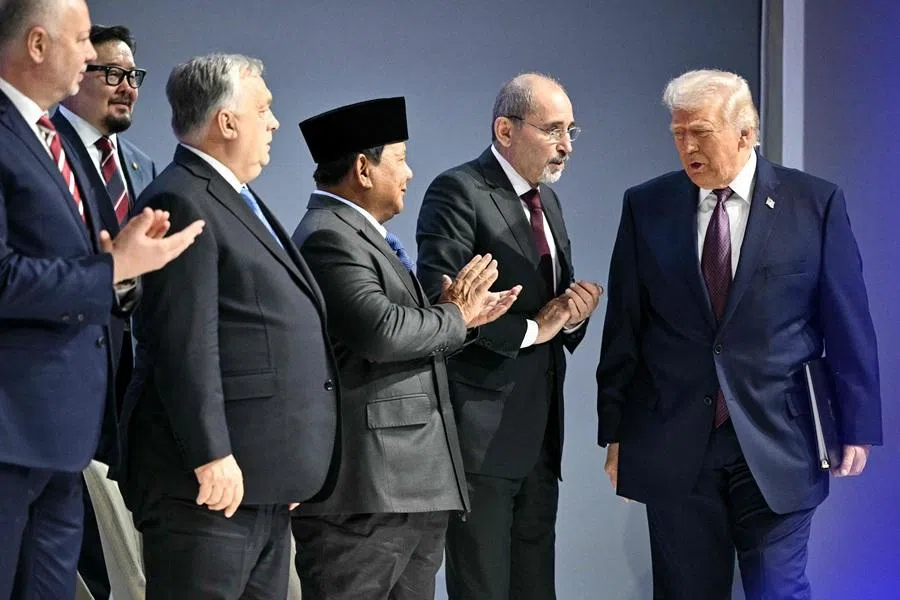 US President Donald Trump (right) arrives at the "Board of Peace" meeting during the World Economic Forum (WEF) annual meeting in Davos on 22 January 2026. (Mandel Ngan/AFP)
