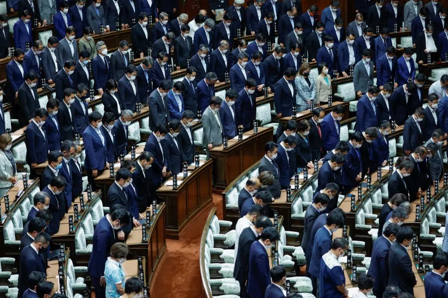 Japanese lawmakers pay condolences to late former Prime Minister Shinzo Abe, who was shot while campaigning for a parliamentary election, while US House of Representatives Speaker Nancy Pelosi visits the lower house hall of the Parliament, in Tokyo, Japan, 5 August 2022. (Issei Kato/Reuters)