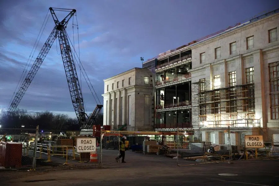 Workers are seen at the Federal Reserve renovation site on 14 January 2026, in Washington, DC.