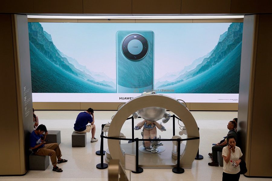An advertisement for Huawei's Mate 60 series smartphones is seen at a Huawei store in Shanghai, China, on 8 September 2023. (Aly Song/Reuters)