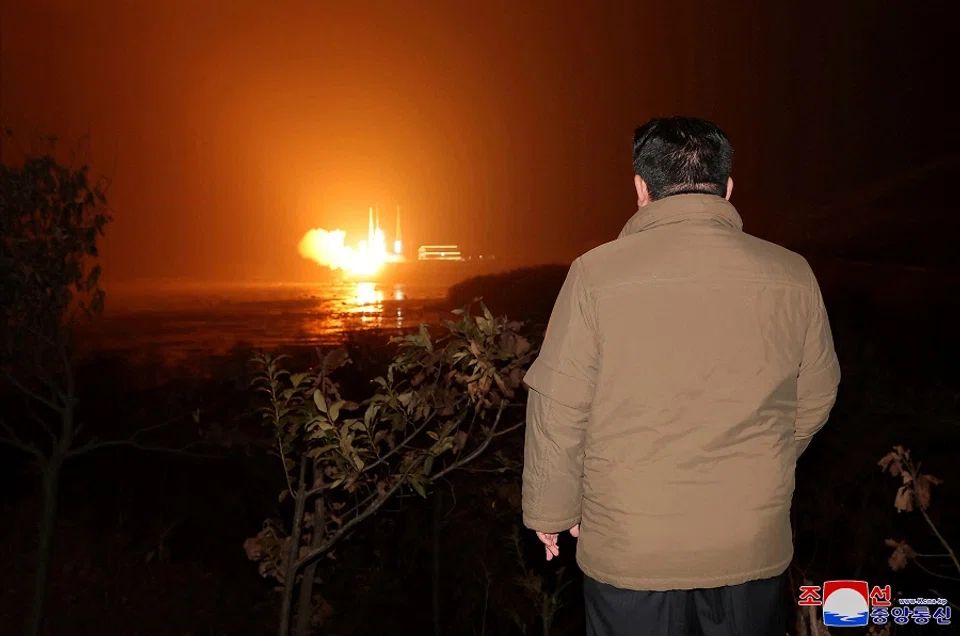 North Korean leader Kim Jong-un looks on as a rocket carrying a spy satellite Malligyong-1 is launched, as North Korean government claims, in a location given as North Gyeongsang province, North Korea in this handout picture obtained by Reuters on 21 November 2023. (KCNA via Reuters)