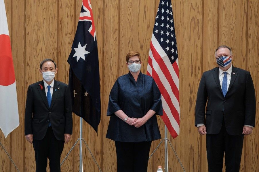 (L-R) Japan's Prime Minister Yoshihide Suga, Australia's Foreign Minister Marise Payne and US Secretary of State Mike Pompeo pose for photographs before a Quad Indo-Pacific meeting at the prime minister's office in Tokyo on 6 October 2020. (Nicolas Datiche/AFP)