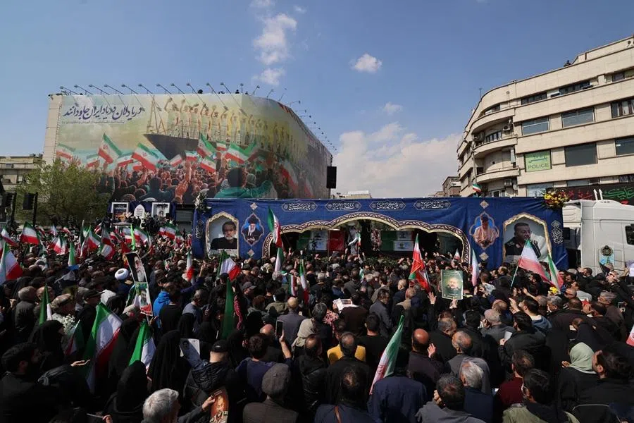 Iranian mourners gather during the funeral of Iran's security chief Ali Larijani and Gholamreza Soleimani, a senior officer in the Islamic Revolutionary Guard Corps who commands Basij forces, in Tehran on 18 March 2026. (Atta Kenare/AFP)